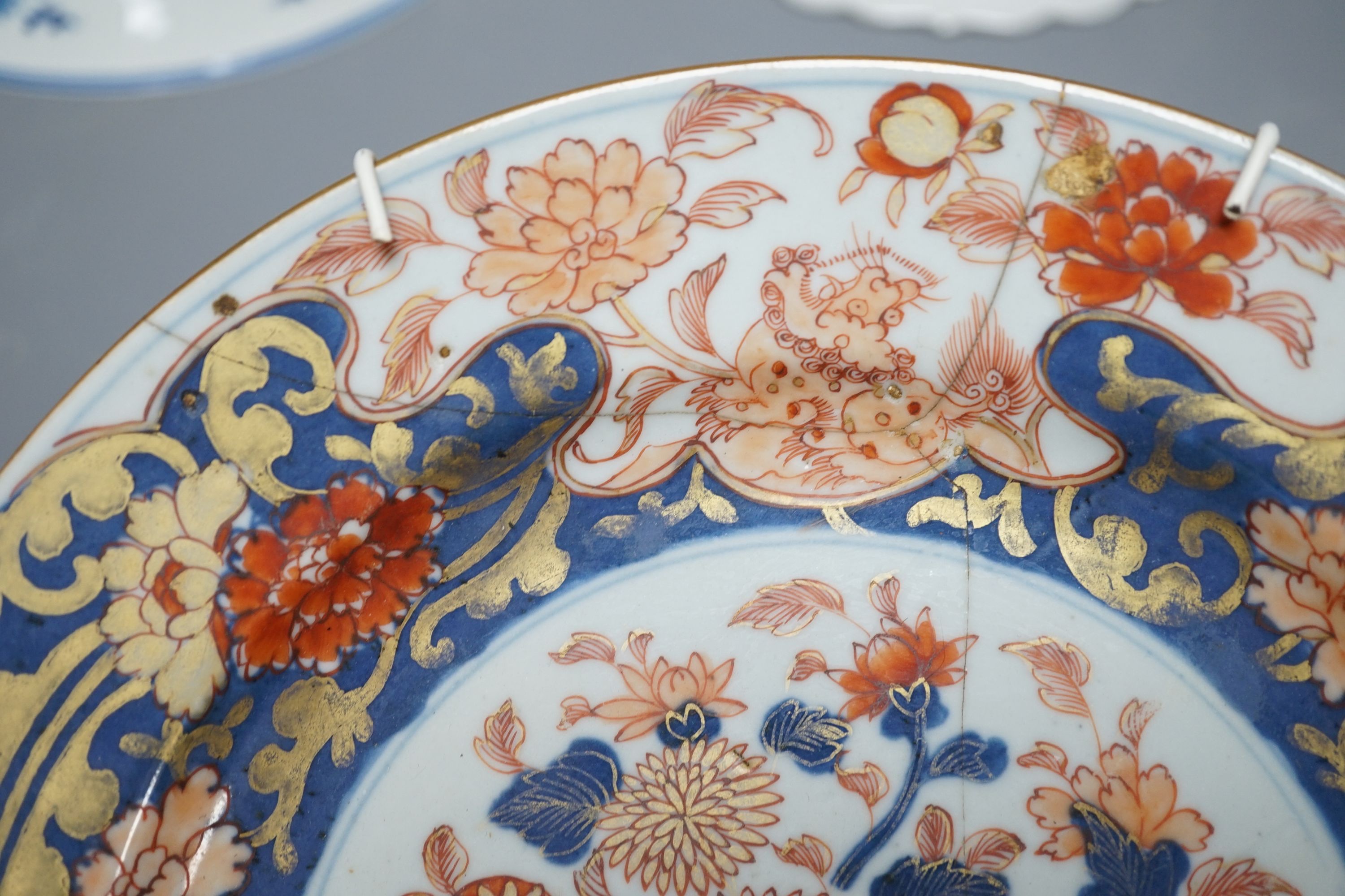 Three Chinese plates including a 19th century Chinese Imari dish, 23cm - repaired, a Chinese famille rose crackleglaze vase, 29cm, together with a famille rose teapot and a crackleglaze celadon ground bottle vase. Talles